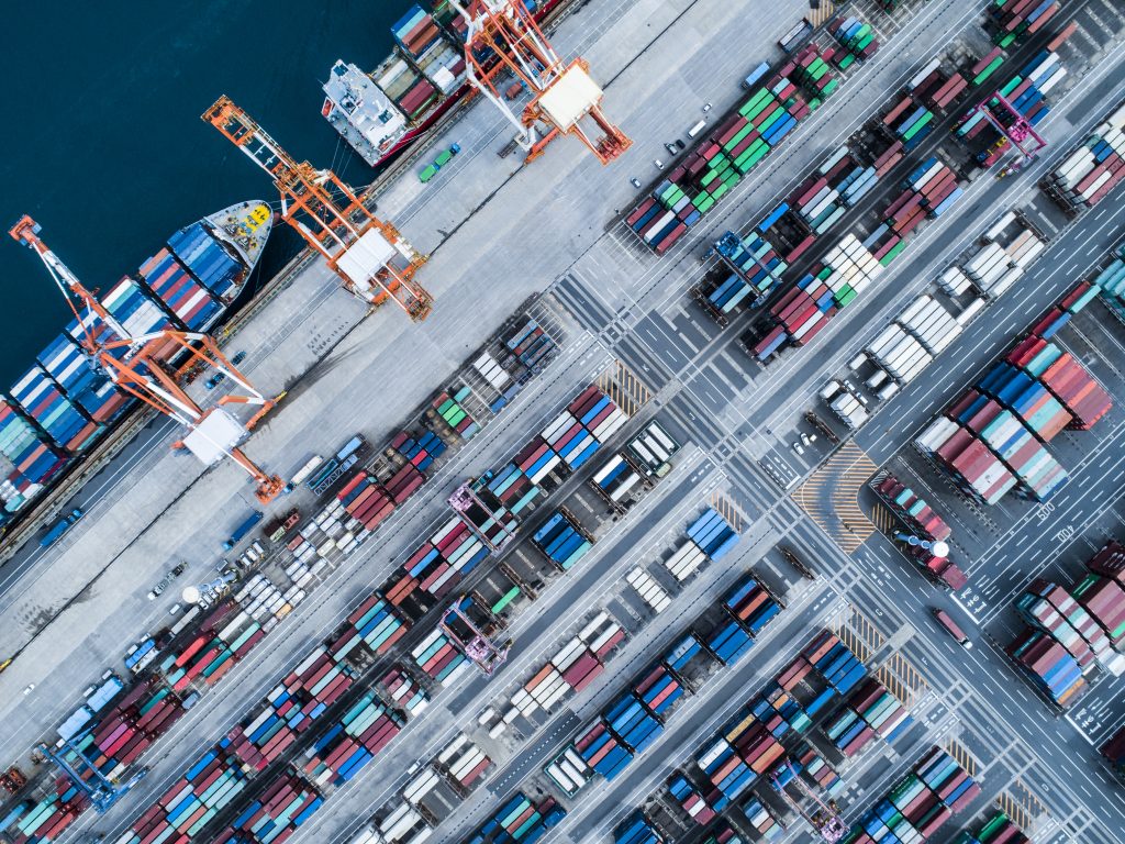 Aerial view of containers and container ship in sea