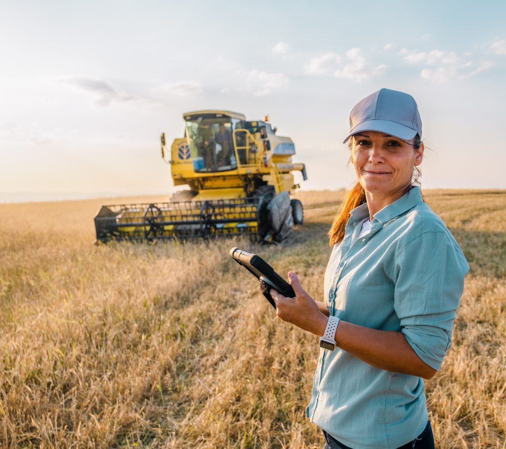 Farmer using a digital tablet in a smart farming field